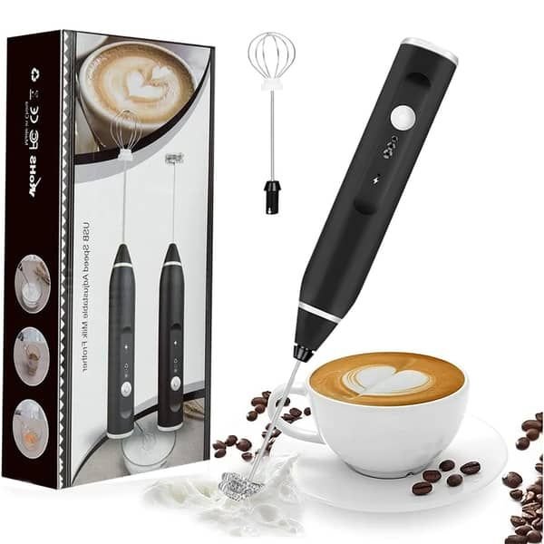 Close-up of rechargeable handheld electric milk frother with USB charging cable and stainless steel whisk attachment.