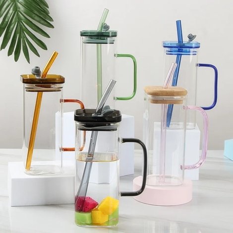 Colorful glass juice mugs with handles, straws and lids in multiple colors