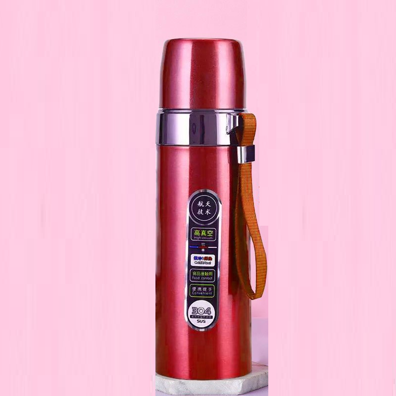 Red stainless steel thermos bottle with lid and portable carry strap