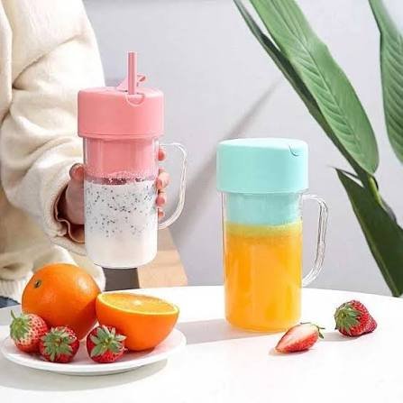 Portable blender cups pink and mint with fresh fruit smoothies