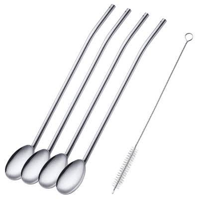 Reusable stainless steel drinking spoon straws on white fabric background